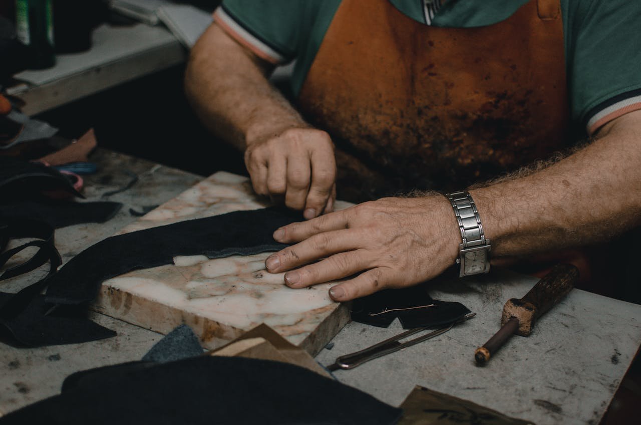 Shoemaker Cutting Leather